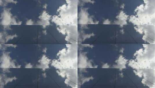 大楼玻璃上的蓝天白云倒影高清在线视频素材下载