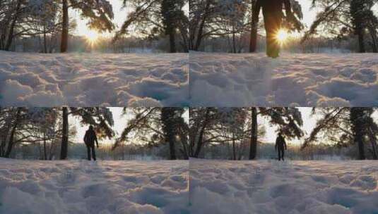 大雪后男子走在逆光的雪地上高清在线视频素材下载