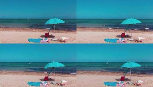 海边蓝色沙滩伞高清在线视频素材下载