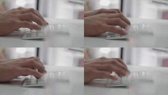 男子在白色键盘上打字高清在线视频素材下载