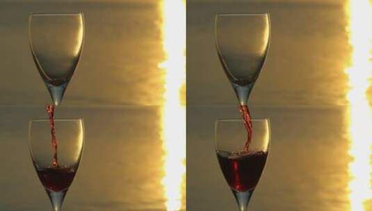 夕阳背景下酒杯中倒入红酒高清在线视频素材下载