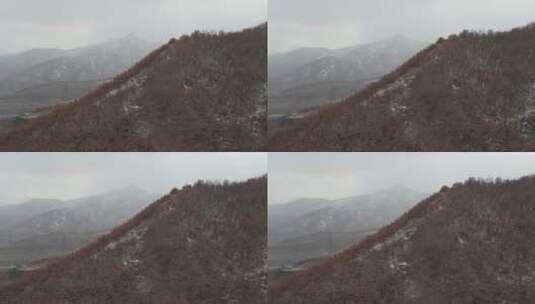 飞越风雪中的里口山山脊高清在线视频素材下载