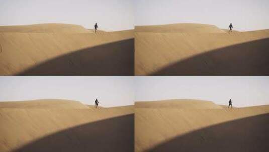 在沙漠里行走的人高清在线视频素材下载