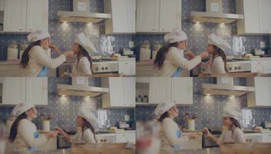 两个小女孩在厨房吃东西高清在线视频素材下载