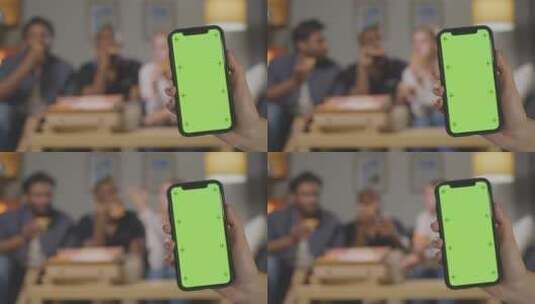 男人拿着绿幕手机的特写镜头高清在线视频素材下载