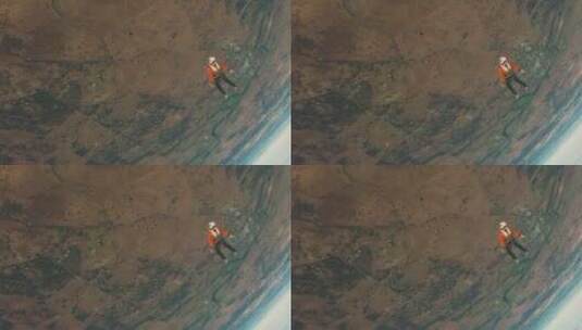 航拍男孩在外太空跳伞高清在线视频素材下载
