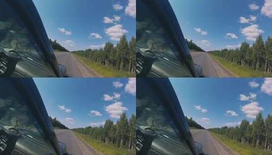 M1汽车行驶在森林公路上高清在线视频素材下载