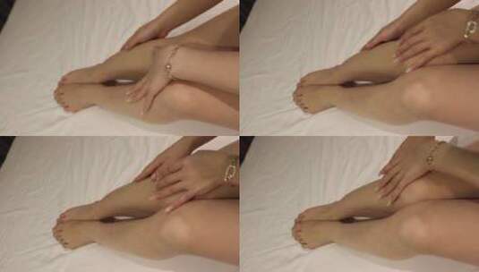 人像身体：美女用手指抚摸自己的小腿高清在线视频素材下载