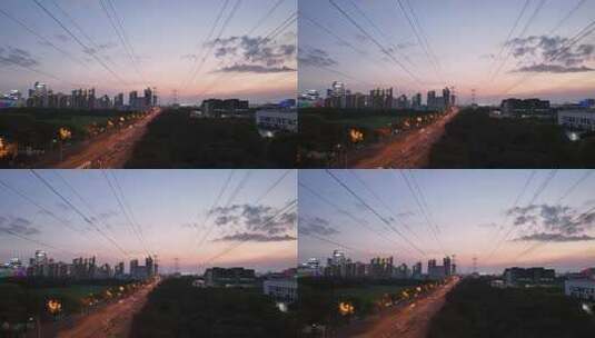 夕阳下城市高压电线塔剪影航拍高清在线视频素材下载