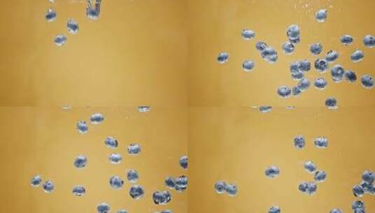 蓝莓在水中坠落和漂浮高清在线视频素材下载