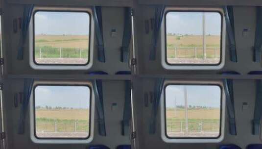行驶中的火车窗外的村庄庄稼风景1高清在线视频素材下载