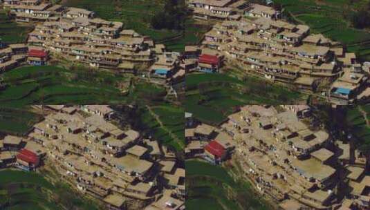 一个村庄在山上的拐角处，人们在散步，屋顶的房子，鸟瞰高清在线视频素材下载