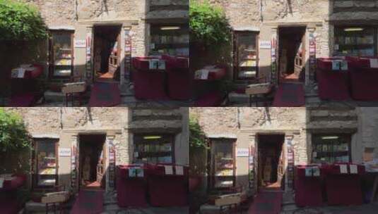 南法小镇老建筑二手书店外陈列里很多书高清在线视频素材下载