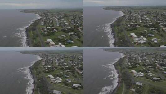 澳大利亚昆士兰州本达伯格沿海城镇岩石海岸上的海浪坠毁。无人机拍摄高清在线视频素材下载
