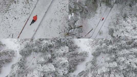 航拍男人躺在鹿儿坪森林中的雪地上高清在线视频素材下载