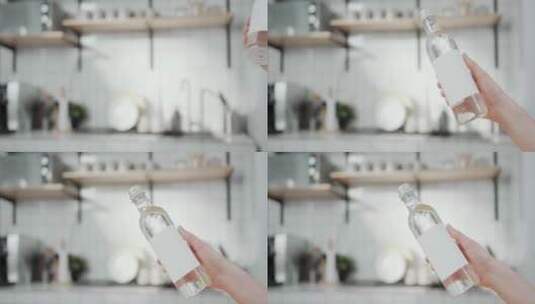 手拿一瓶水的特写高清在线视频素材下载