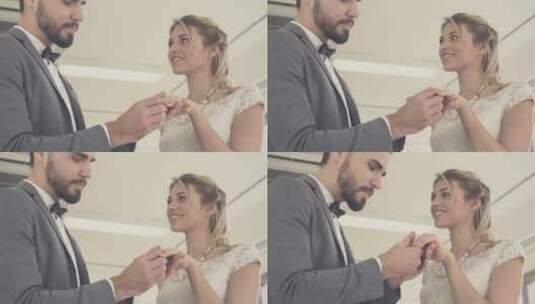 新郎为新娘戴上结婚戒指并亲吻她的手高清在线视频素材下载