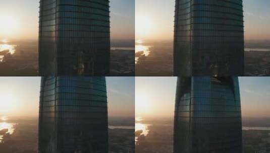 日出时沿高楼大厦上升片段高清在线视频素材下载