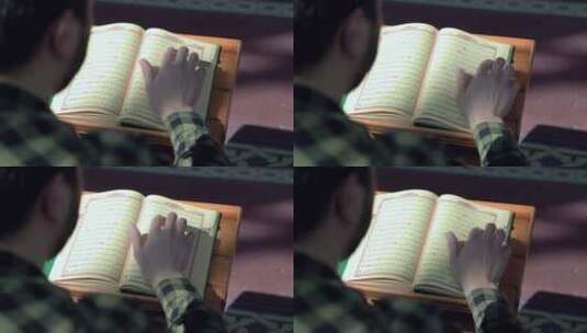 年轻人在清真寺里阅读古兰经高清在线视频素材下载