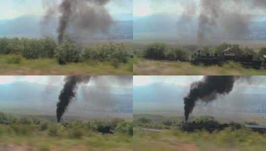 蒸汽火车穿过山脉排放的烟雾高清在线视频素材下载
