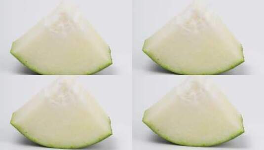 白背景的新鲜蔬菜蔬果冬瓜4k滑轨平移高清在线视频素材下载