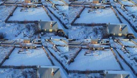 航拍大兴安岭寒冬季日暮时分雪村人家高清在线视频素材下载