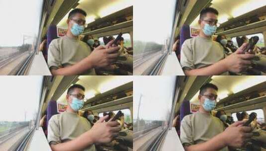 男性旅客在高铁动车组上使用手机高清在线视频素材下载