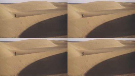 沙漠中行走的男人高清在线视频素材下载