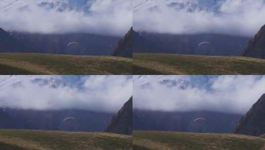 山脉里滑滑翔伞的人高清在线视频素材下载