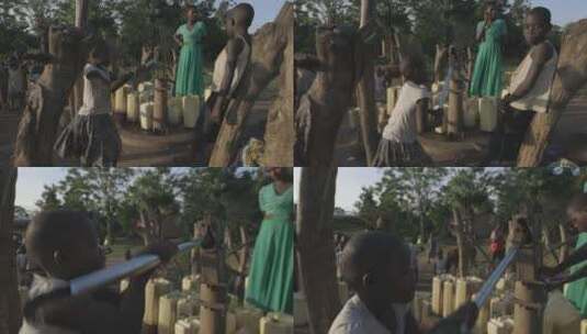 非洲女孩按压旧式井打水高清在线视频素材下载