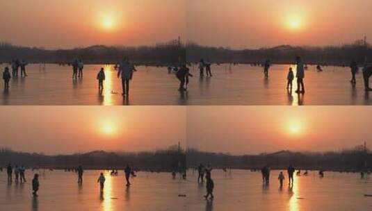 夕阳下冰面滑冰的游客人群高清在线视频素材下载