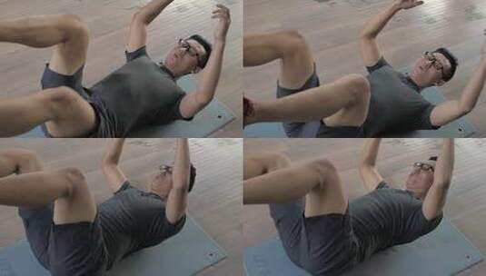 男子在健身房进行热身运动。高清在线视频素材下载