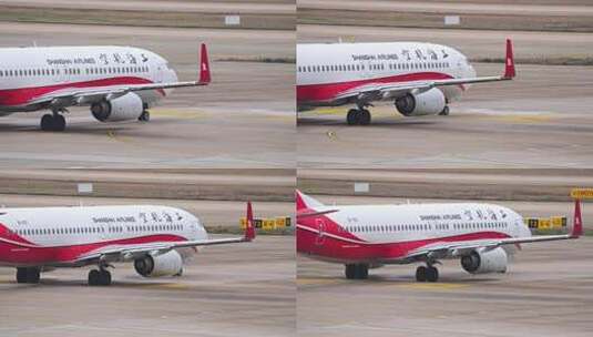 上海航空飞机在浦东机场跑道滑行高清在线视频素材下载