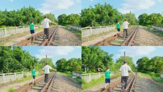 母子 母爱 妈妈带小孩走在铁路上高清在线视频素材下载