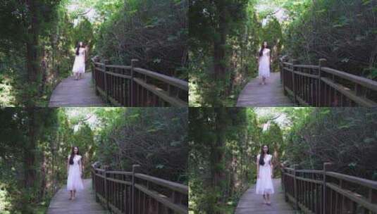 人与自然 女生走在木栈道高清在线视频素材下载