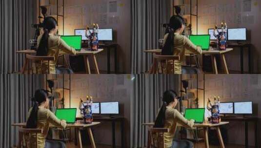 十几岁的亚洲女孩在家用模拟绿屏设计笔记本电脑上的电子手的后视图高清在线视频素材下载