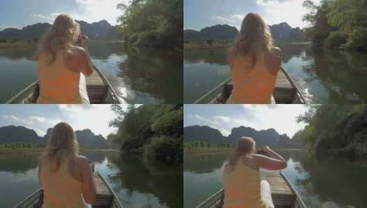 船上带相机的金发女子在拍照高清在线视频素材下载