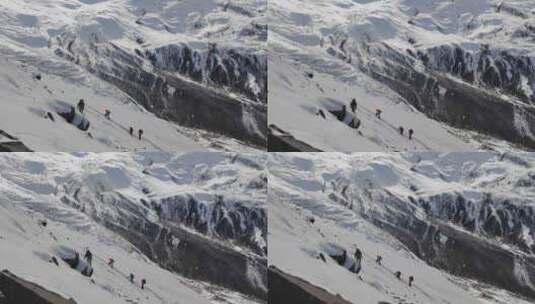 四川甘孜攀登乌库楚雪山的登山者大雪中徒步高清在线视频素材下载