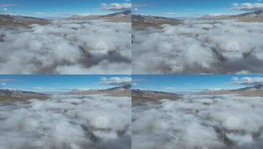 航拍西藏拉萨当雄云雾缭绕下的念青唐古拉山高清在线视频素材下载