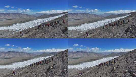 航拍攀登新疆慕士塔格峰雪山的登山队高清在线视频素材下载