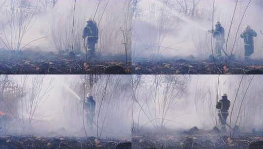 两名装备消防员用消防水带扑灭森林大火。慢高清在线视频素材下载