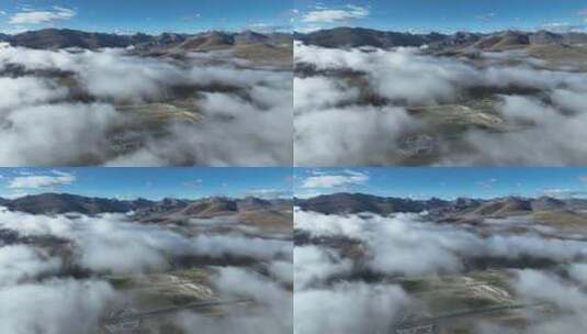 航拍西藏拉萨当雄云雾缭绕下的念青唐古拉山高清在线视频素材下载