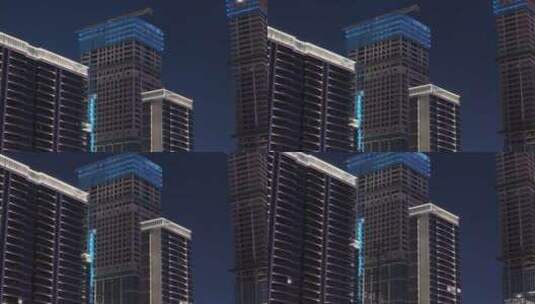 仰视夜景城市楼盘房地产开发建设施工下降高清在线视频素材下载
