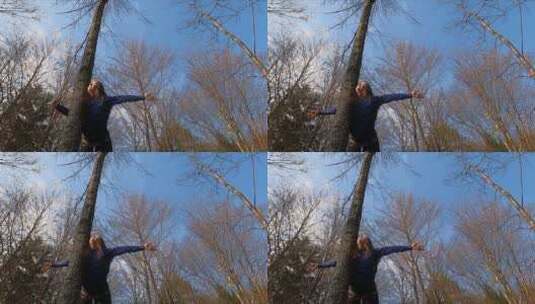 女人倚在树干上高清在线视频素材下载