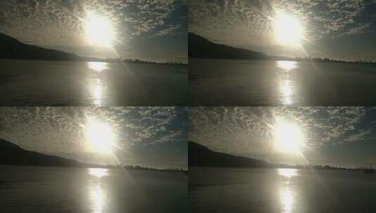太阳的光芒反射在湖面上高清在线视频素材下载