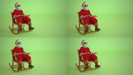 戴口罩的圣诞老人坐在椅子上高清在线视频素材下载