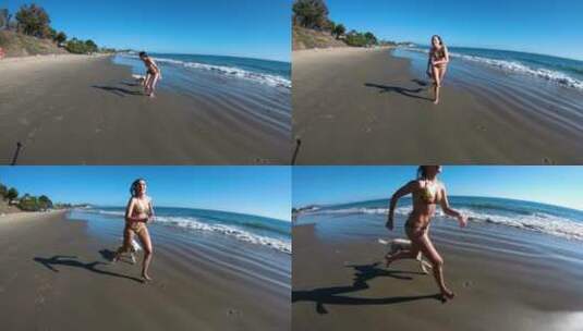 在海滩上和狗狗玩耍的女人高清在线视频素材下载