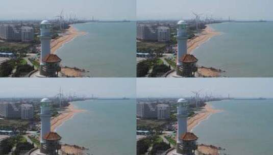 海洋沙滩灯塔风发电大风车高清在线视频素材下载