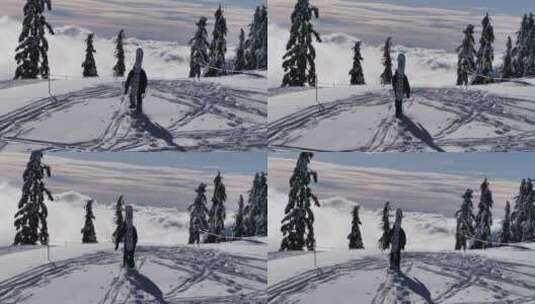 雪山山顶上的滑雪者高清在线视频素材下载