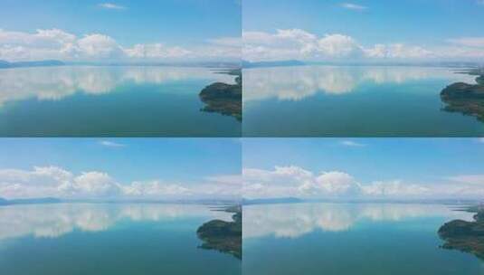 蓝天白云下的湖泊倒影航拍高清在线视频素材下载